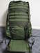 1991 Ford Bronco - A green tactical backpack is shown standing upright against a wall.