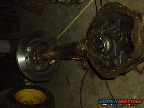Rear axle assembly with disc brake rotor and differential housing