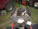 1990 Ford Bronco - Engine block on stand with parts removed, showing internal components.