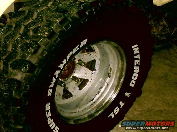 Close-up of a Super Swamper TSL tire on a chrome wheel