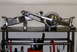 1996 Ford Bronco - Polished rear axle assembly with differential housing and suspension arms displayed on a metal stand.
