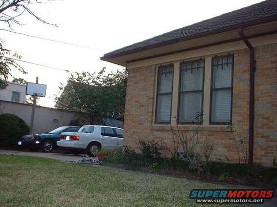 White 1996 Ford Taurus sedan parked curbside