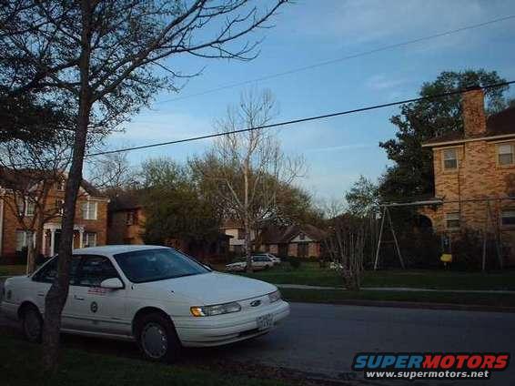 White 1996 Ford Taurus sedan parked curbside