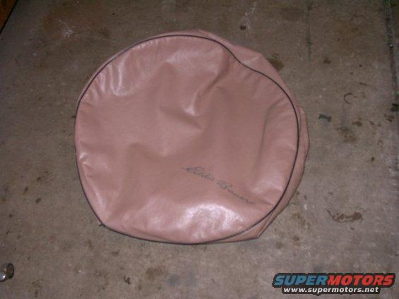 Tan spare tire cover with black trim and embroidered 'Eddie Bauer' text