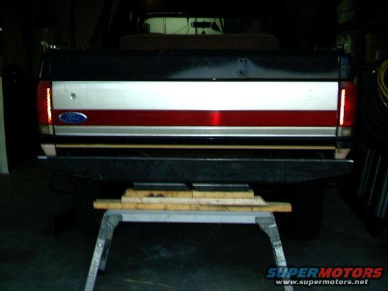1989 Ford Bronco rear bumper and tailgate with red, white, and silver stripe