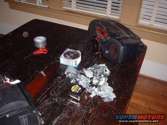Black electronic device with red accents on a wooden table