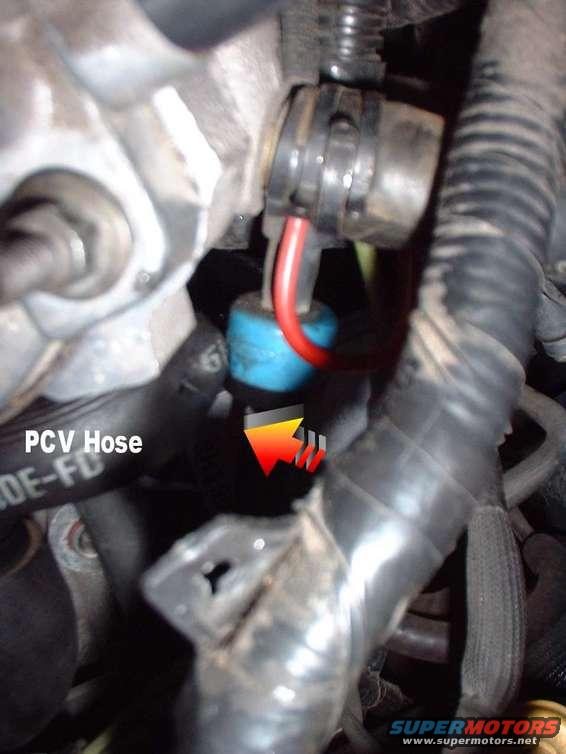 PCV hose with red wire and blue connector, engine bay detail
