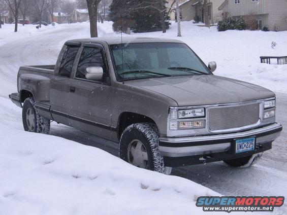 img_3365.jpg new chrome gmc grille with billet insert and rice lights!!