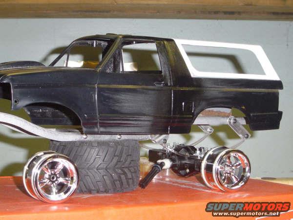 model Bronco body on a chassis with chrome wheels and a large tire