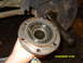 1989 Ford Bronco - Close-up of a disassembled spindle bearing assembly, showing internal splines and wear.