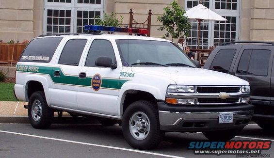 White Chevrolet Suburban with Border Patrol livery and light bar