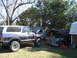 1949 Chevrolet C/K Pickup - A 1949 Chevrolet C/K Pickup sits in a yard with a blue Ford Bronco and another vehicle.