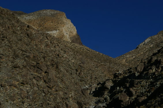 Rocky desert mountains under a clear blue sky