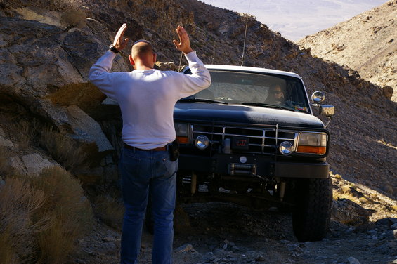 Black Ford Bronco with winch on rocky terrain