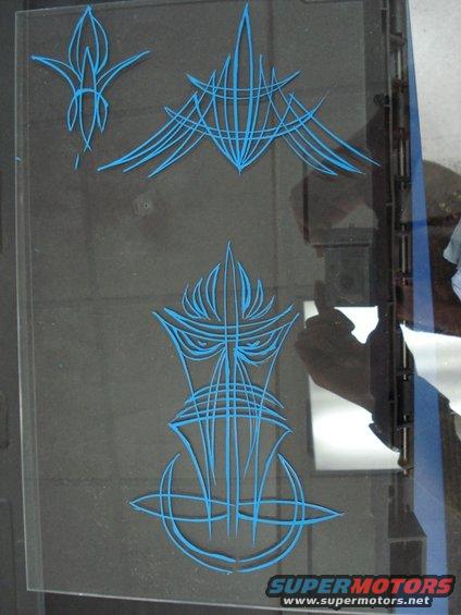 blue pinstripe art on clear glass panel