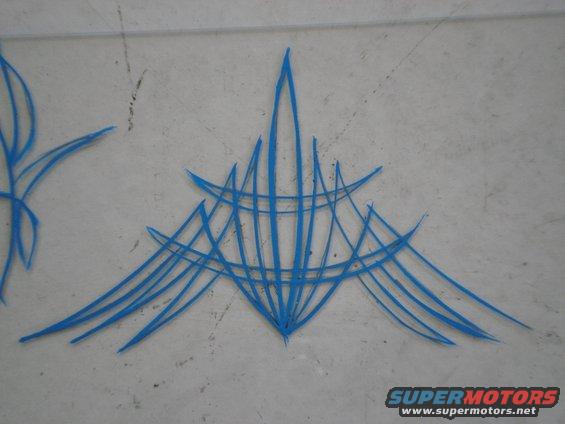 Blue pinstriping on a gray surface. Supermotors.net logo visible