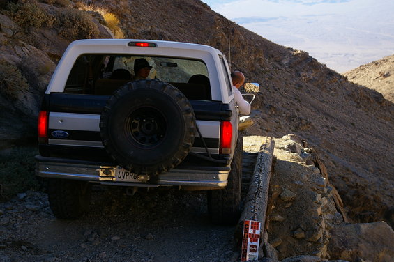 1986 Ford Bronco rear view on narrow mountain road