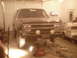 1984 Chevrolet Blazer - Front view of a black 1984 Chevrolet Blazer lifted on jacks in a garage.