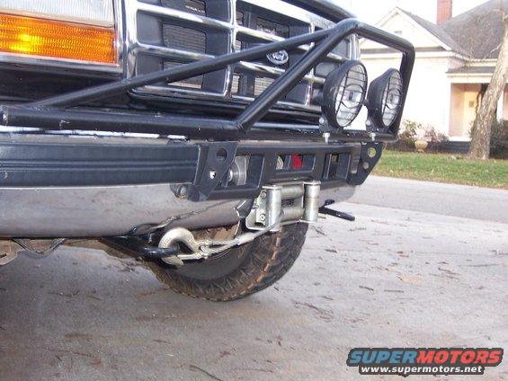 Ford truck front end with winch, brush guard, and lights. Looks like a 1996 model