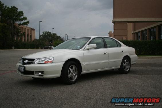 White 2003 Acura TL parked outside a building