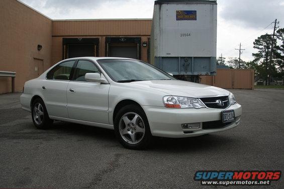 White 2003 Acura TL sedan parked outdoors, front 3/4 view