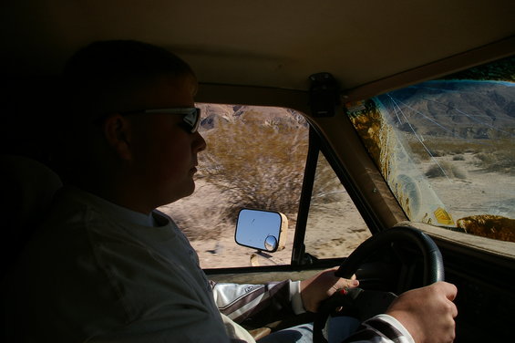 Interior view of 1986 Ford Bronco driver in desert