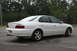 2003 Acura TL - Rear view of a white 2003 Acura TL sedan parked on asphalt.