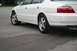 2003 Acura TL - The rear side of a white 2003 Acura TL sedan is shown parked on asphalt.