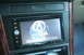 2003 Acura TL - The Acura navigation system screen displays the brand logo and a globe graphic.