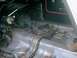 1976 Ford Ranchero - The interior of a vehicle shows significant disarray with exposed wiring and rust, indicating a state of disrepair.