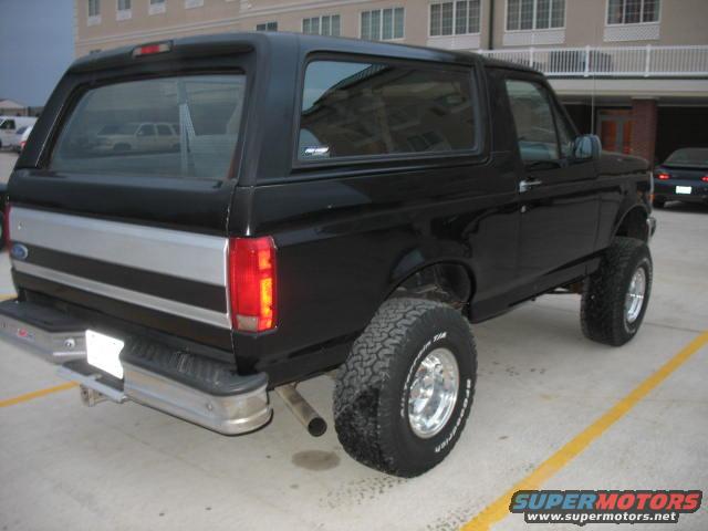 Black 1996 Ford Bronco with lifted suspension parked in a lot