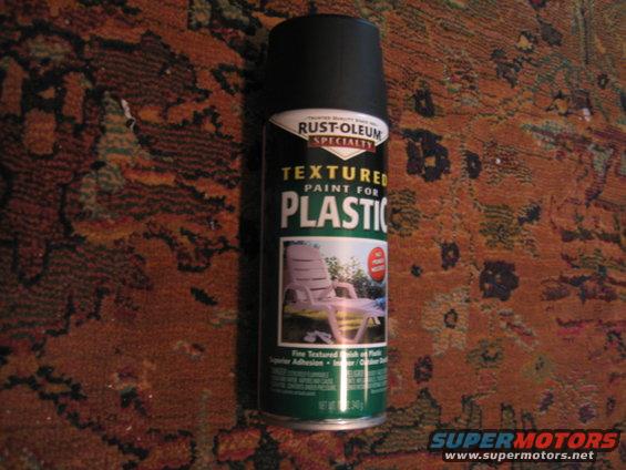 Can of Rust-Oleum textured paint for plastic, sitting on a patterned rug