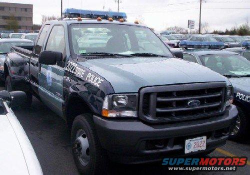 Ford F-350 Super Duty dually truck with "STATE POLICE" markings and light bar