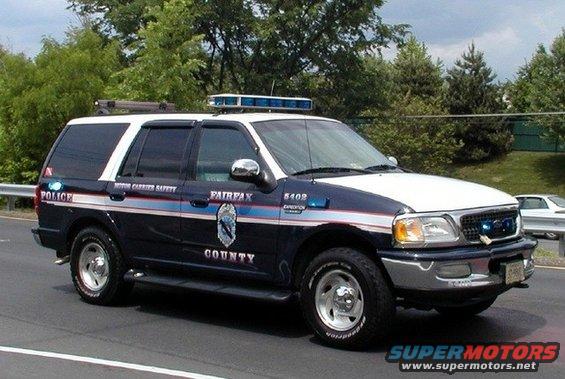Fairfax County police SUV with light bar on roof. Text on side reads 'POLICE', 'MOTOR CARRIER SAFETY', 'FAIRFAX COUNTY'