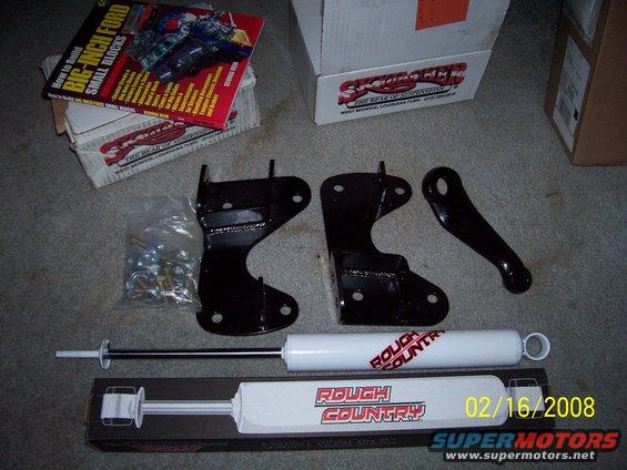 Rough Country lift kit components and 'How to Build Big-Inch Ford Small Blocks' book