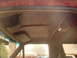 1992 Ford Bronco - View of the interior ceiling, showing the headliner, sun visor, and overhead light fixture.