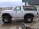 1983 Ford Bronco - Fender flares on, but sagging in the rear. The lift used the stock wedge and a 4" block in the rear.