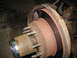 1995 Ford C-350 (Centurion Conversions) - This image shows a close-up view of a vehicle's wheel hub and brake assembly, highlighting the rusty components.