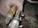 1995 Ford C-350 (Centurion Conversions) - Working on a front axle assembly with an impact wrench.