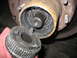 1995 Ford C-350 (Centurion Conversions) - The internal splines of a vehicle's front hub assembly are exposed, with the locking mechanism held in a hand.