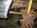 1995 Ford C-350 (Centurion Conversions) - Front axle components, including a shock absorber and brake rotor, are visible in this close-up view.