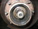 1995 Ford C-350 (Centurion Conversions) - This image shows a heavily greased and splined front wheel hub assembly, likely requiring maintenance or repair.