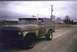 1978 Ford Bronco - This classic 1978 Ford Bronco sits on a gravel road with houses and trees in the background under a cloudy sky.