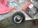 1995 Ford C-350 (Centurion Conversions) - Worn suspension bushing on a rusty metal part, likely needing replacement.