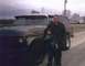 1978 Ford Bronco - A man and child pose in front of a 1978 Ford Bronco on a cloudy day.