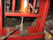 1995 Ford C-350 (Centurion Conversions) - A hydraulic press is used to work on a rusty automotive part, likely a tie rod end.