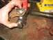 1995 Ford C-350 (Centurion Conversions) - Working on universal joint and driveshaft components, possibly for a front axle rebuild.