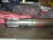1995 Ford C-350 (Centurion Conversions) - Close-up of an axle shaft, likely for a heavy-duty vehicle, showing wear and rust.