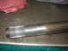 1995 Ford C-350 (Centurion Conversions) - Close-up of a metal axle shaft with visible wear and splines.