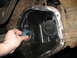 1995 Ford C-350 (Centurion Conversions) - A hand installs a bearing into the differential housing of a vehicle, revealing internal gears.
